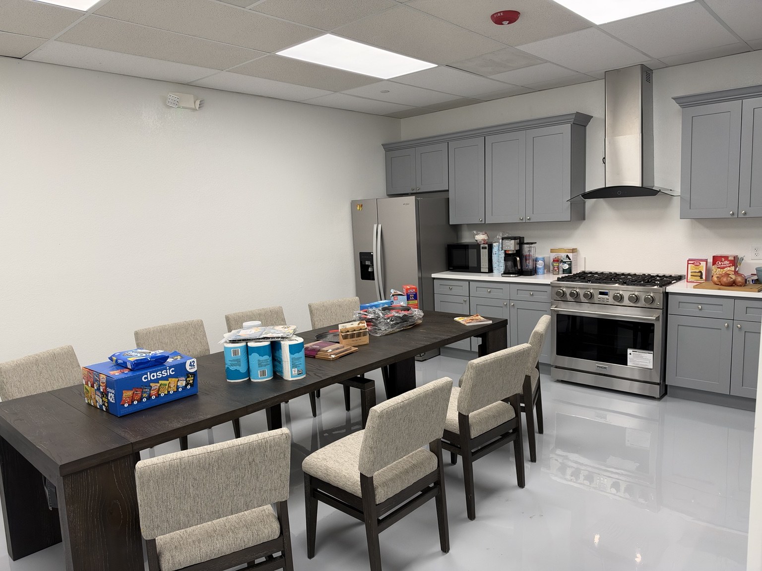 Cooking area with a kitchen counter, oven, and dining table